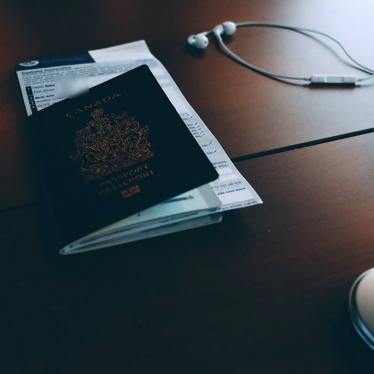Passport and customs declaration on a desk — border checks after an INTERPOL Red Notice